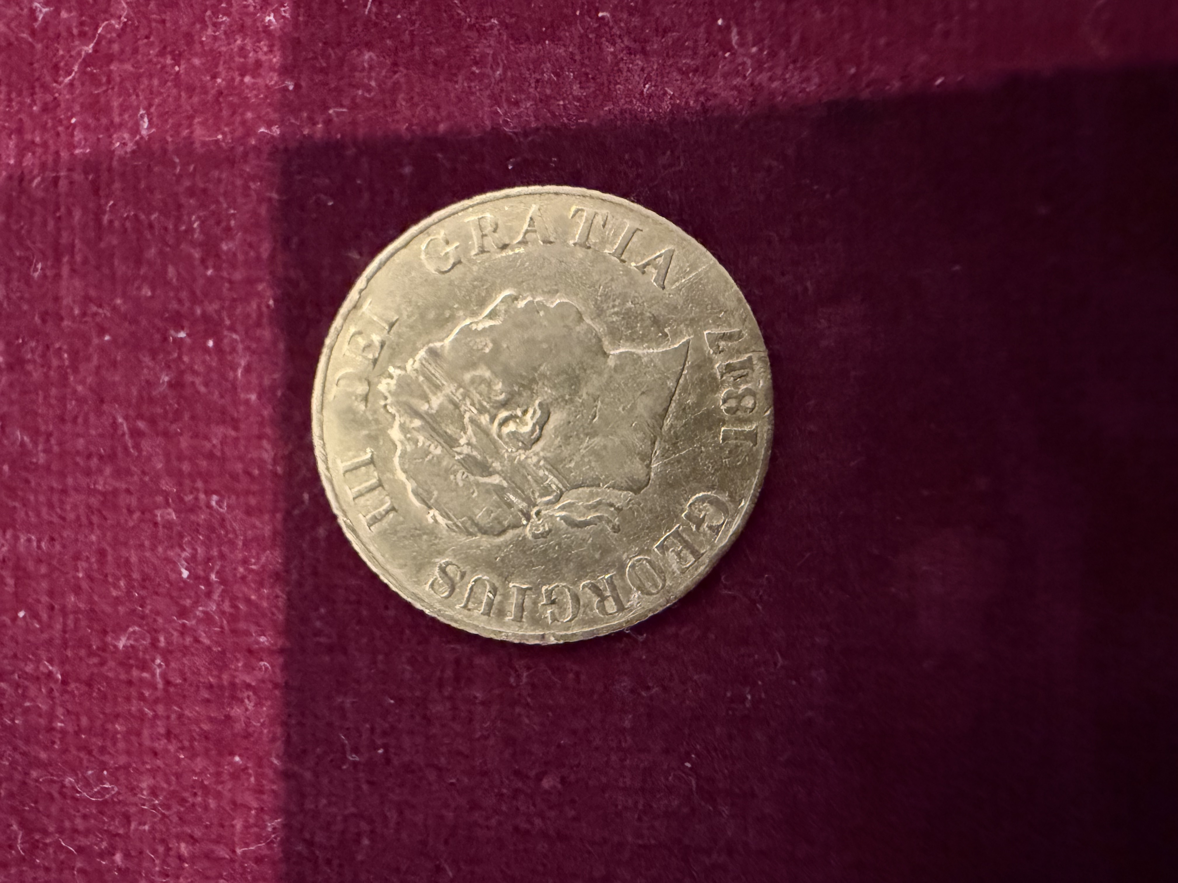 George III silver coin dated 1818 reading Georgius III Dei Gratia, found by metal detecting