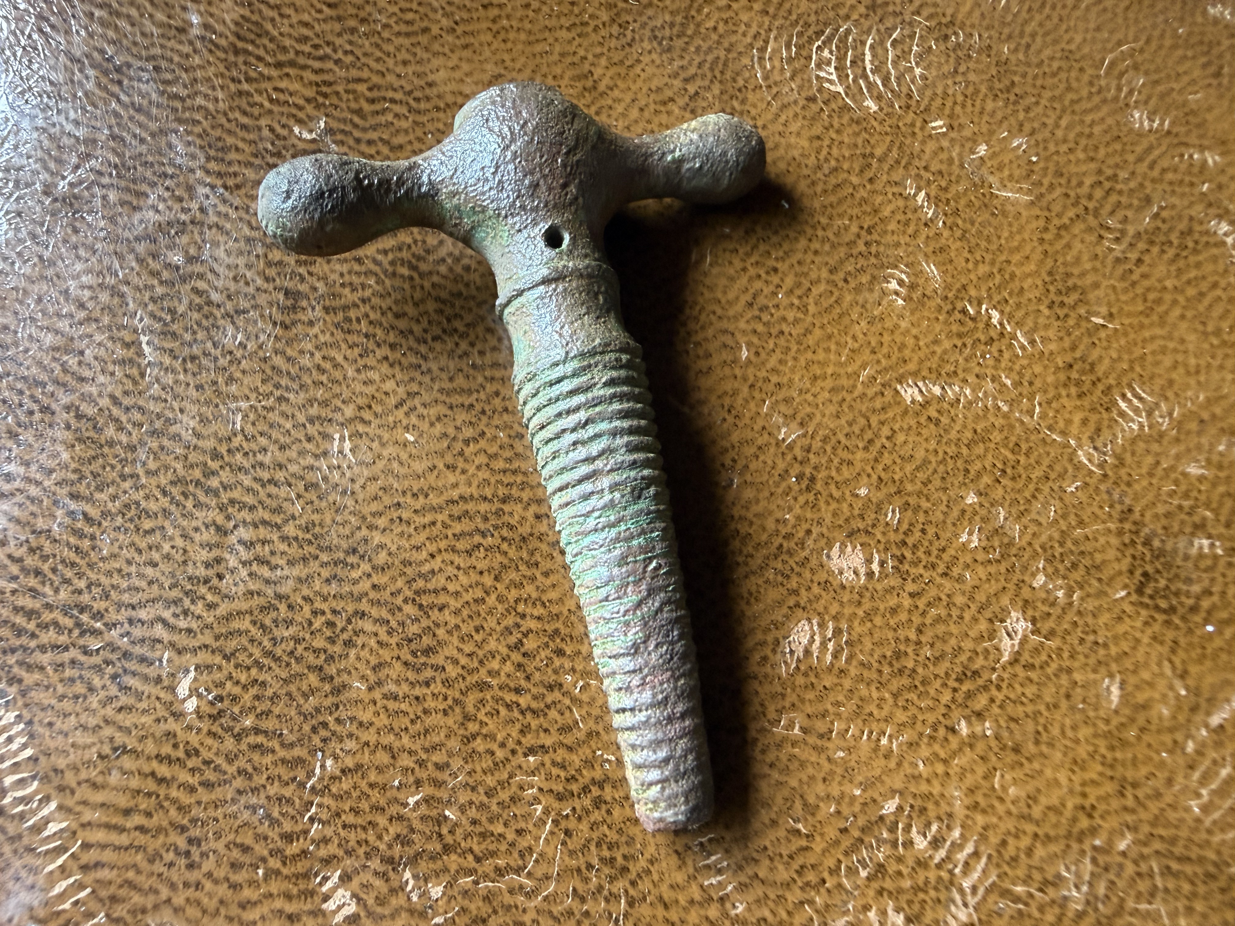 Corroded bronze T-shaped handle or key with ribbed grip and verdigris patination, found by metal detecting
